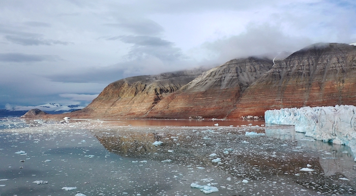 Figure 4. A view looking at Collethøgda Mountain. It&#39;s notable that the glacier face was at the tip of the peninsula visible in the right side of the image, and that that was almost 2km away from the current glacier face. Photo courtesy of Mark Goldner.