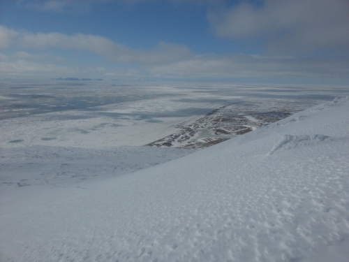 4 May 2014 - Looking WNW across the Bering Strait. Shorefast ice shows evidence of thaw from the preceding week, with large melt ponds showing up as light blue in color.